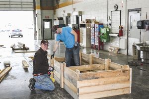 Meridian volunteers built 10 flower beds for a local veteran's garden.