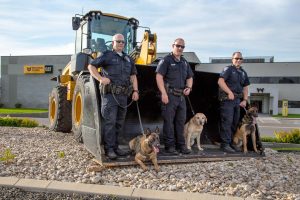 Left to right - Officer Isaiah Wear with K9 Odin, Officer Tyler Marston with K9 Dory and Officer Rick Lee with K9 Randy.
