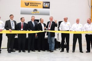 Pocatello Store Idaho Governor C.L. "Butch" Otter (hand raised) and CEO Tom Terteling (fourth from left) get set to cut the ribbon.