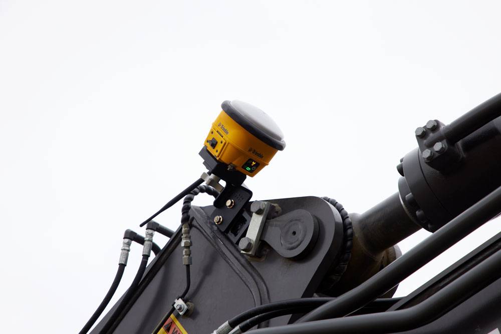 A Trimble Rover installed on a machine arm.